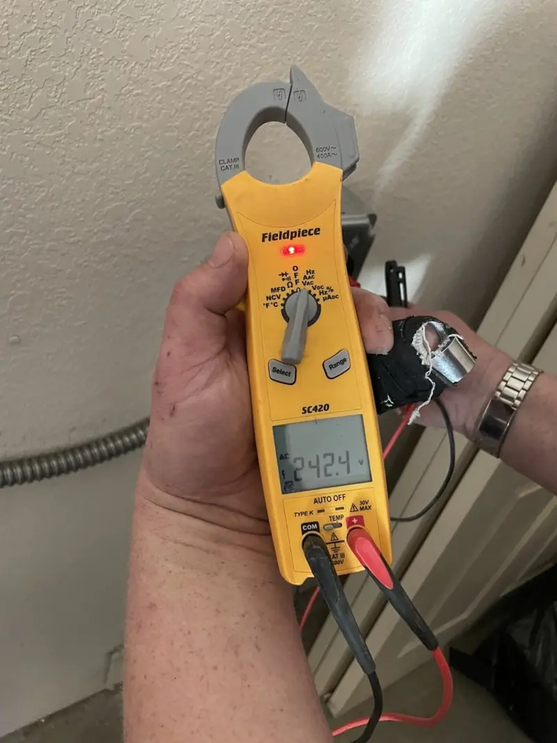 Voltage testing with clamp meter during Recessed Lighting Installation in Jacksonville